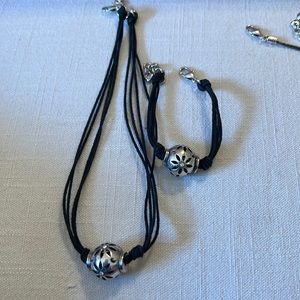 Leather strap necklace,bracelet, earrings set with pendant with crystals.